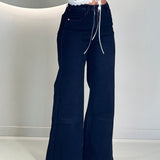 Jeans denim dark con cuciture red